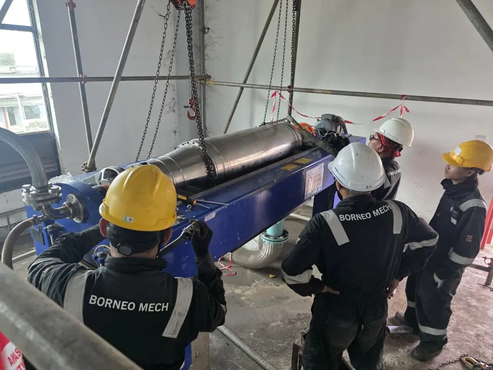 Team inspecting a decanter centrifuge bowl