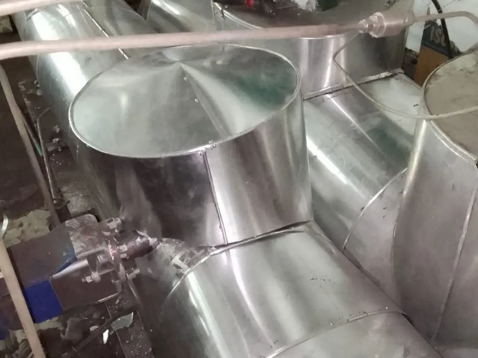 Finished aluminium cladding on intersecting pipes